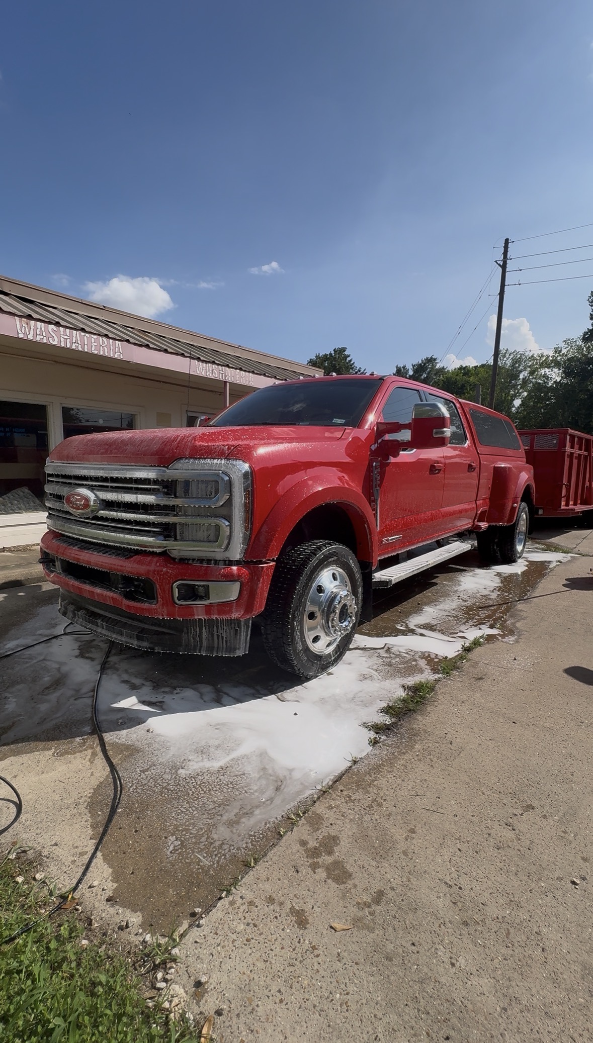 Red Ford Super Duty receiving a professional exterior wash from WVM Detail